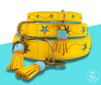 Yellow Urban Bluestar dog collar with star patterns and tassels on a blue background