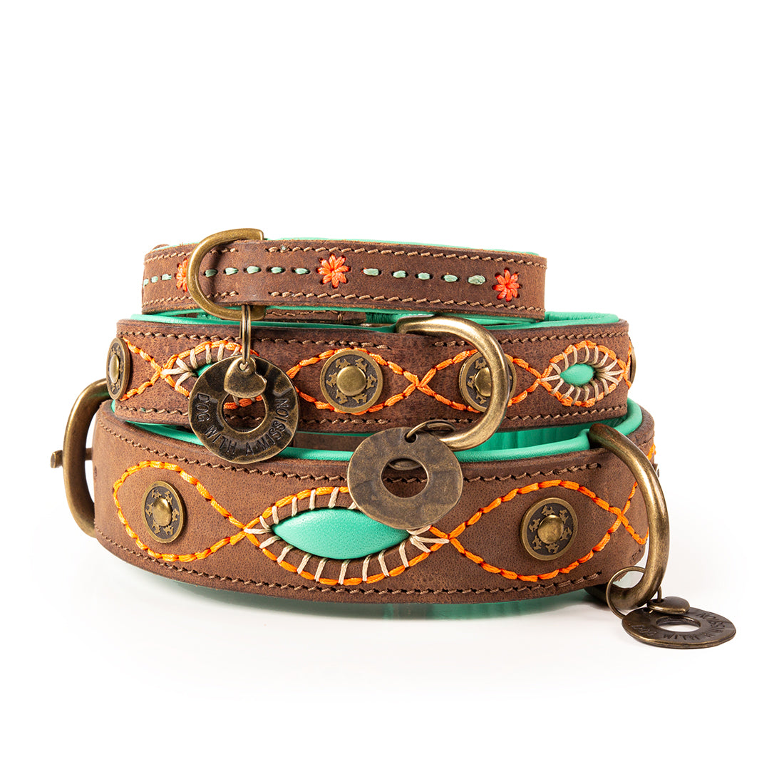 Brown leather dog collar with decorative elements on a white background