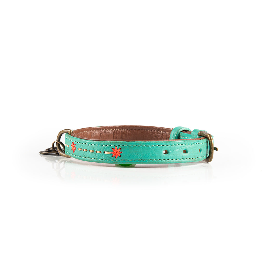 Turquoise dog collar with floral designs on a white background