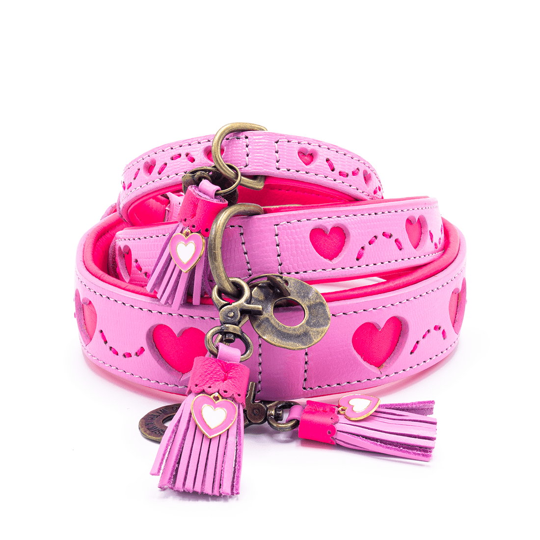 Pink dog collar and leash set with heart designs and tassels on a white background