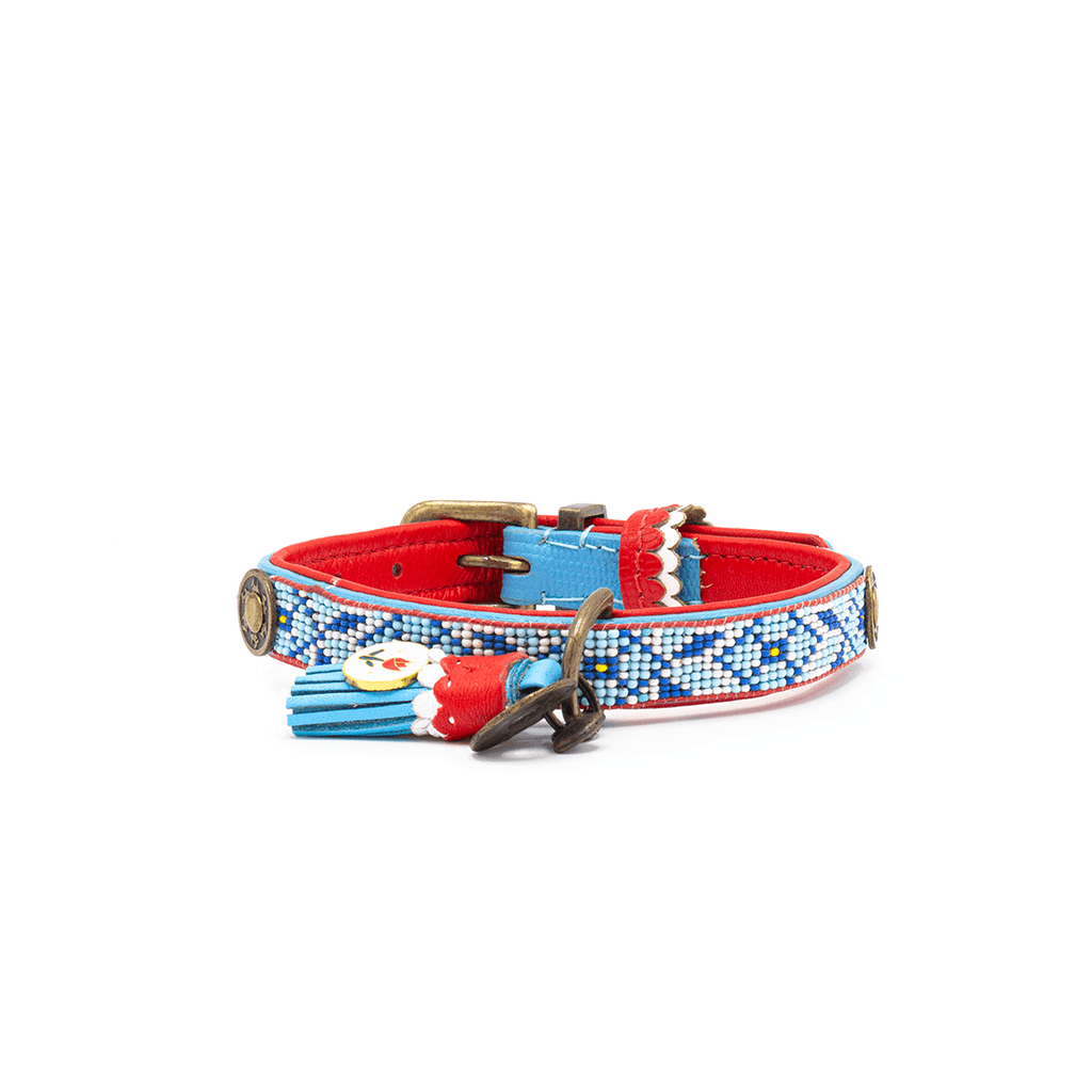 Decorative dog collar with red, blue, and white patterns on a white background