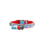 Decorative dog collar with red, blue, and white patterns on a white background