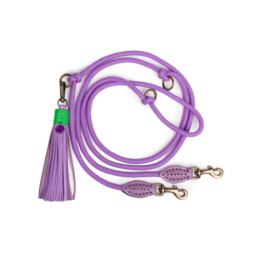 Purple dog leash with a tassel on a white background