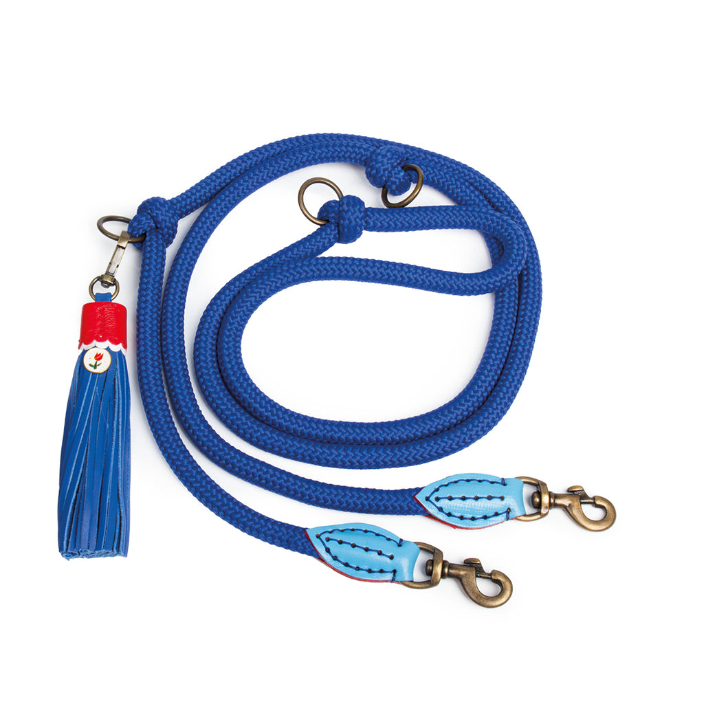 Blue dog leash with a tassel on a white background