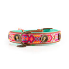 Colorful dog collar with patterned design on a white background
