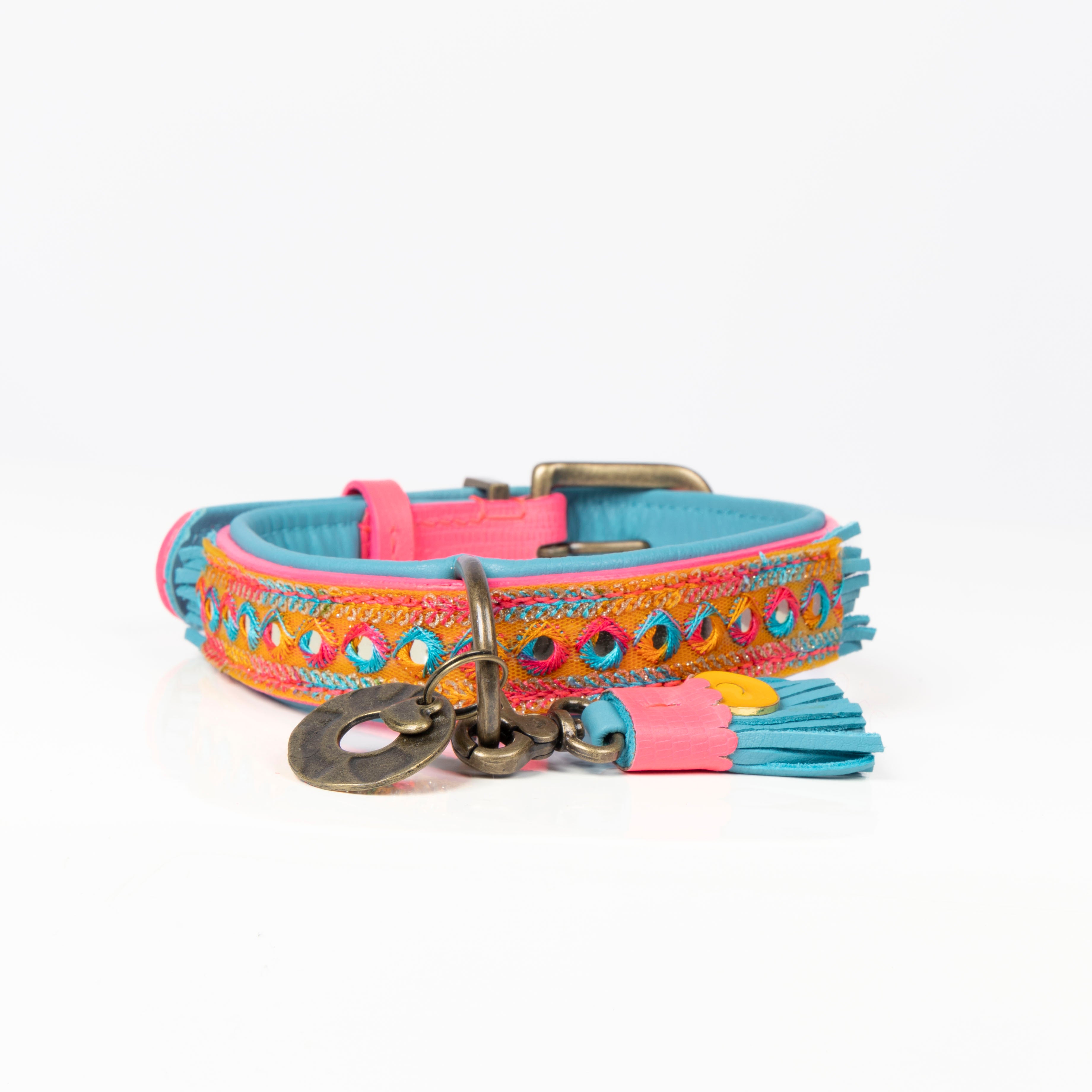 Colorful dog collar with decorative elements on a white background