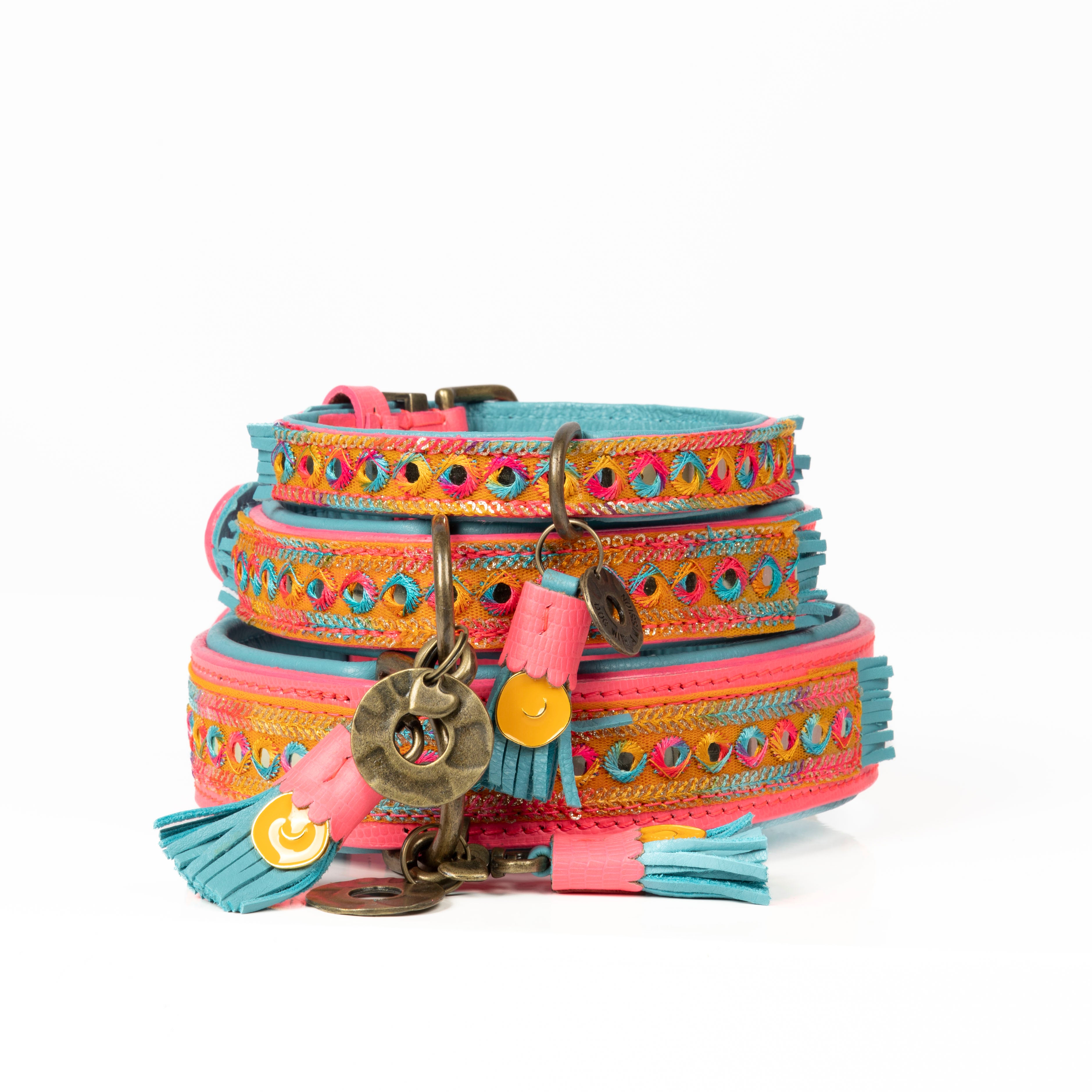 Colorful dog collar with decorative elements on a white background