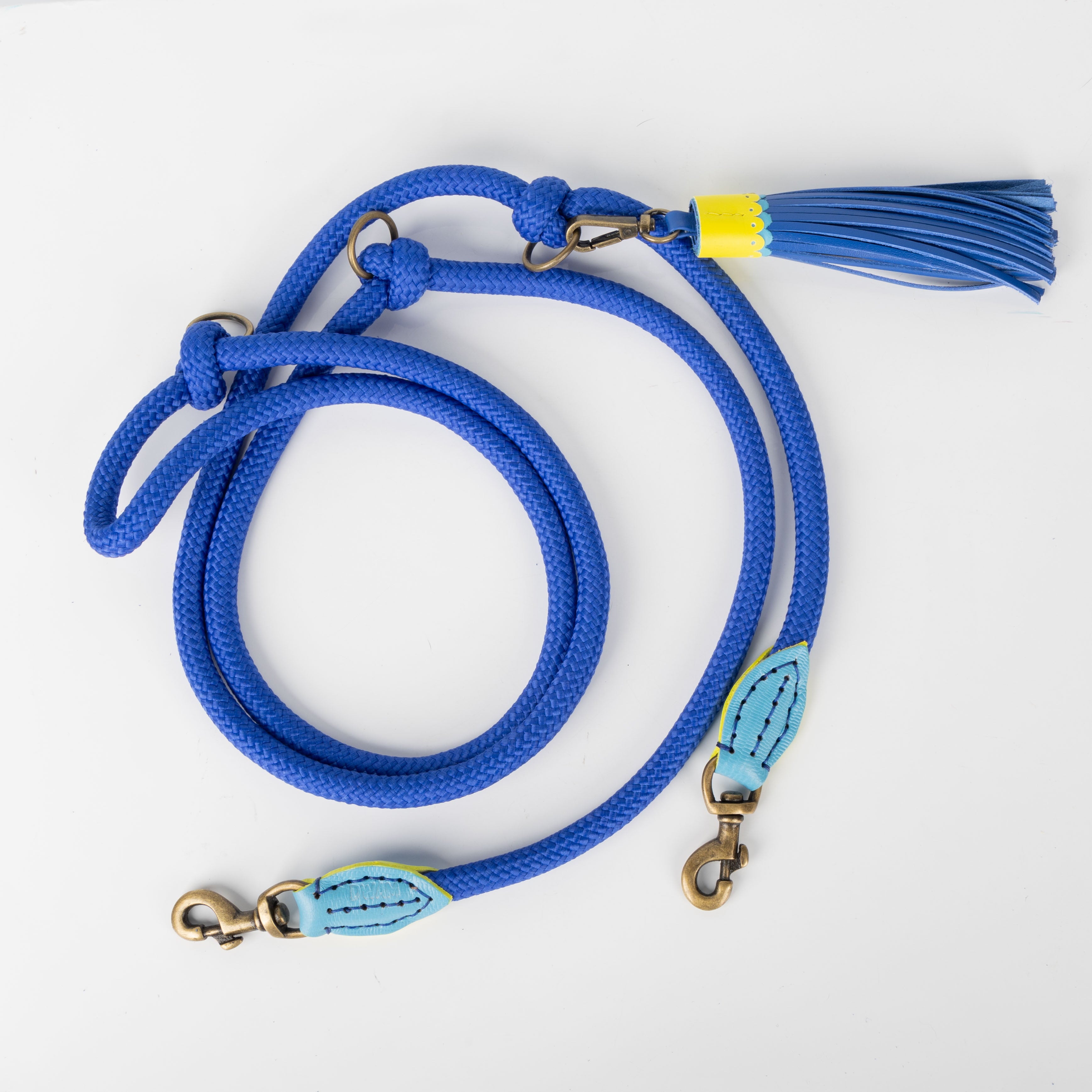 Blue dog leash with a tassel on a white background